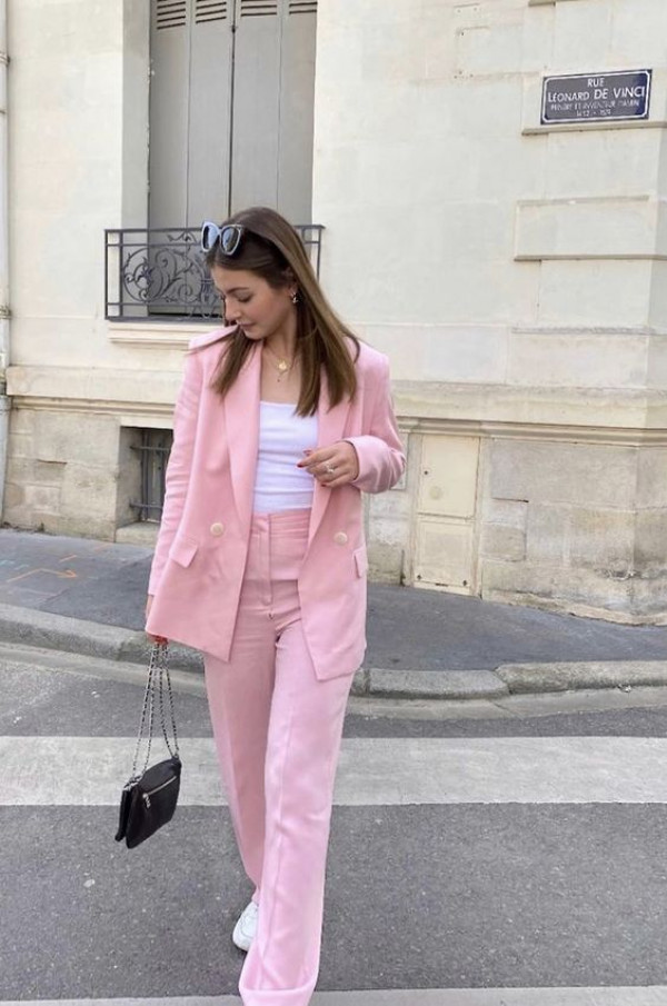 pink suit with white top